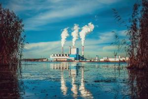a factory with smoke coming out of it's stacks